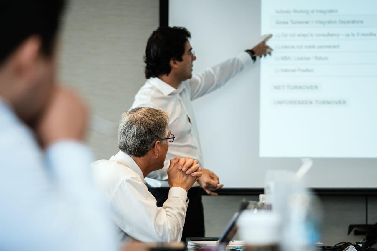 Executive presenting to colleagues in a meeting room