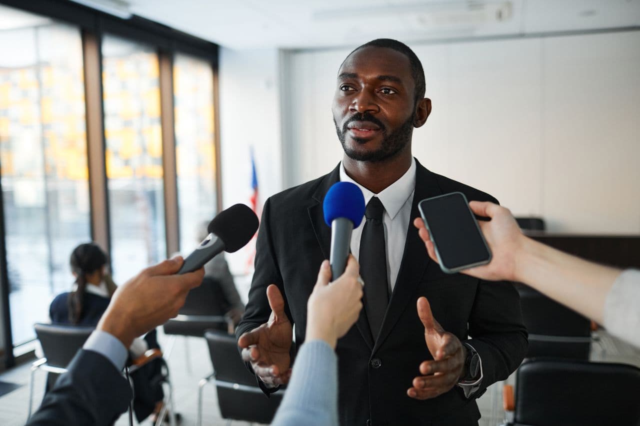 Executive answering questions from the press